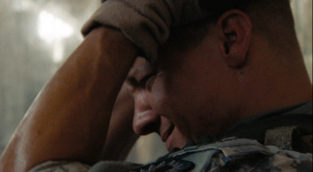 Scene still - James places his hand